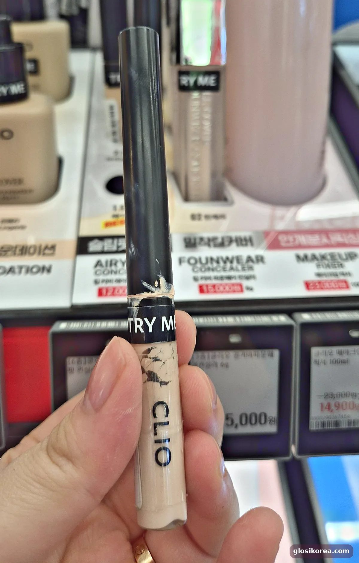 CLIO Kill Cover Airy-Fit Concealer tester held in hand at Olive Young