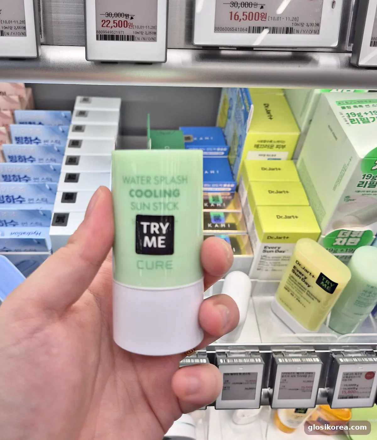CURE Water Splash Cooling Sun Stick held in hand at Olive Young