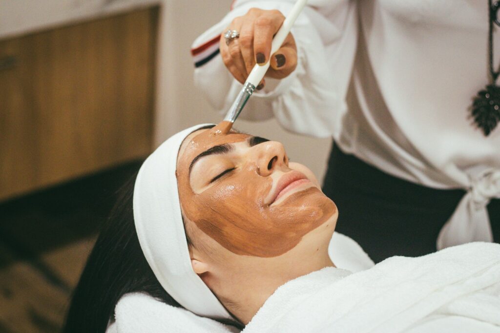 A woman getting a facial treatment