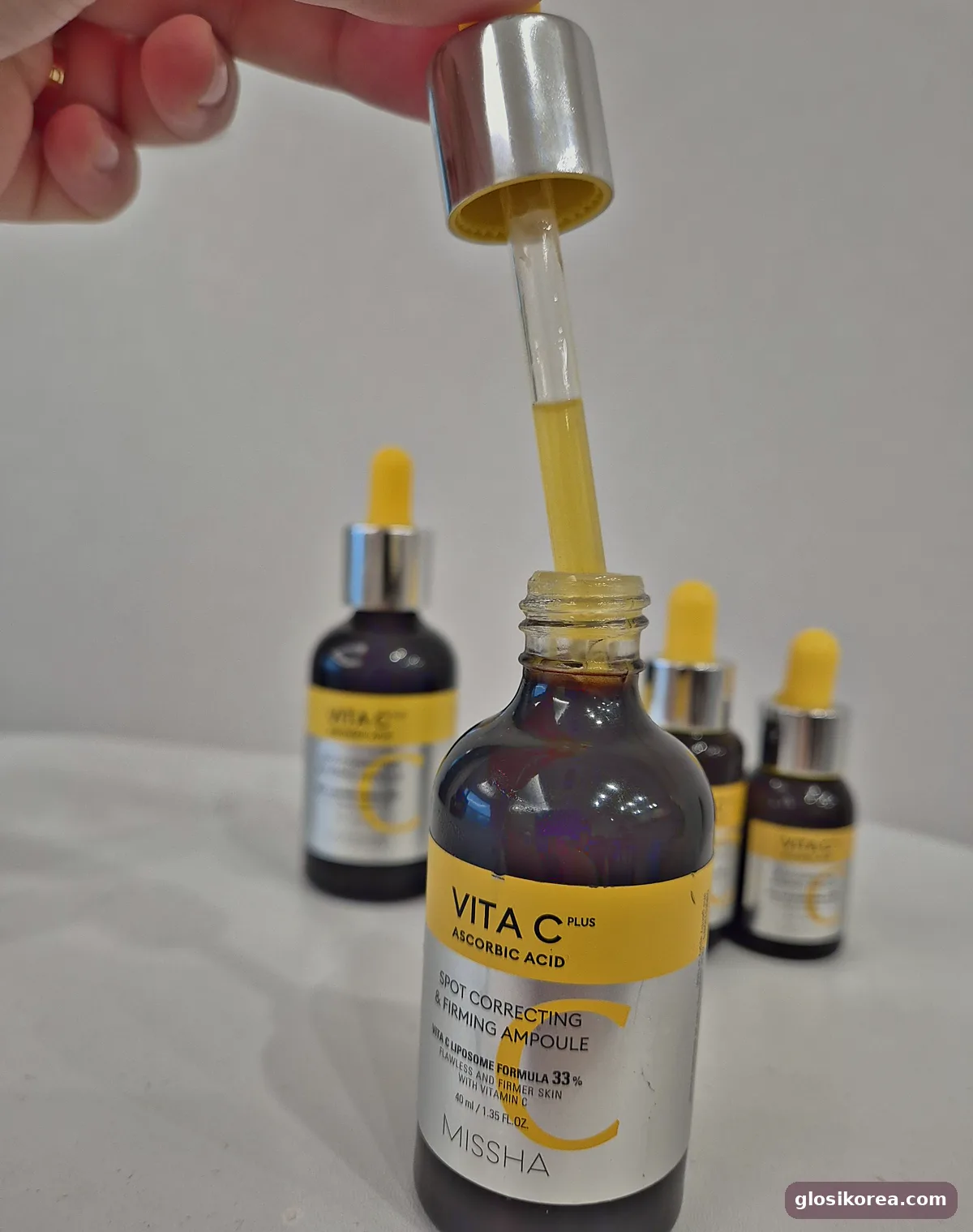 MISSHA Vita C Plus ampoule dropper showing the yellow vitamin C texture