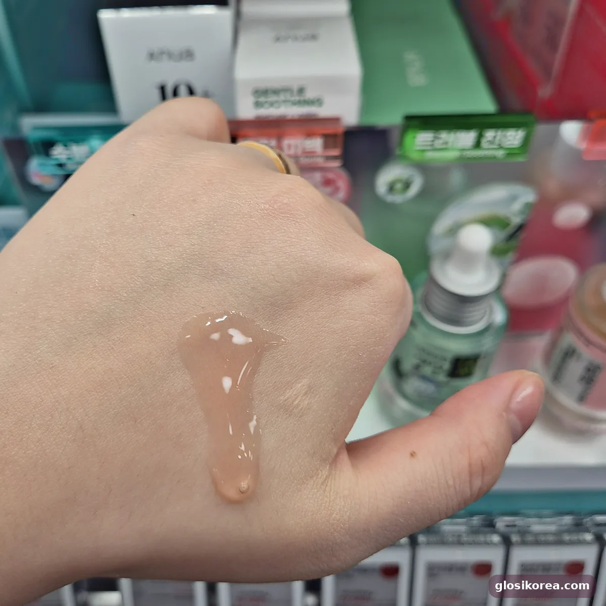 Anua Niacinamide 10 + TXA 4 serum texture swatch on the back of a hand