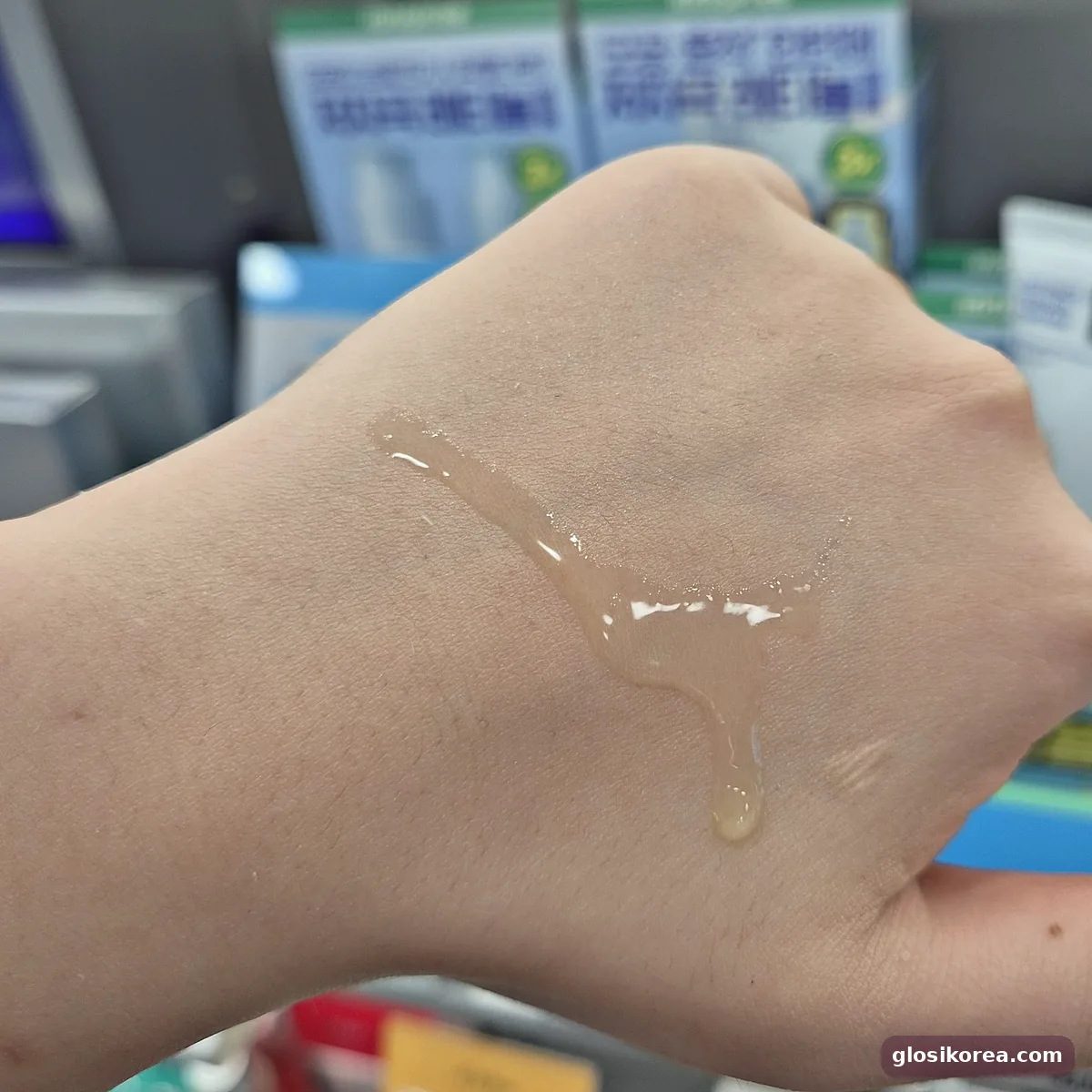 COSRX Vitamin C 23 serum texture swatch on the back of a hand