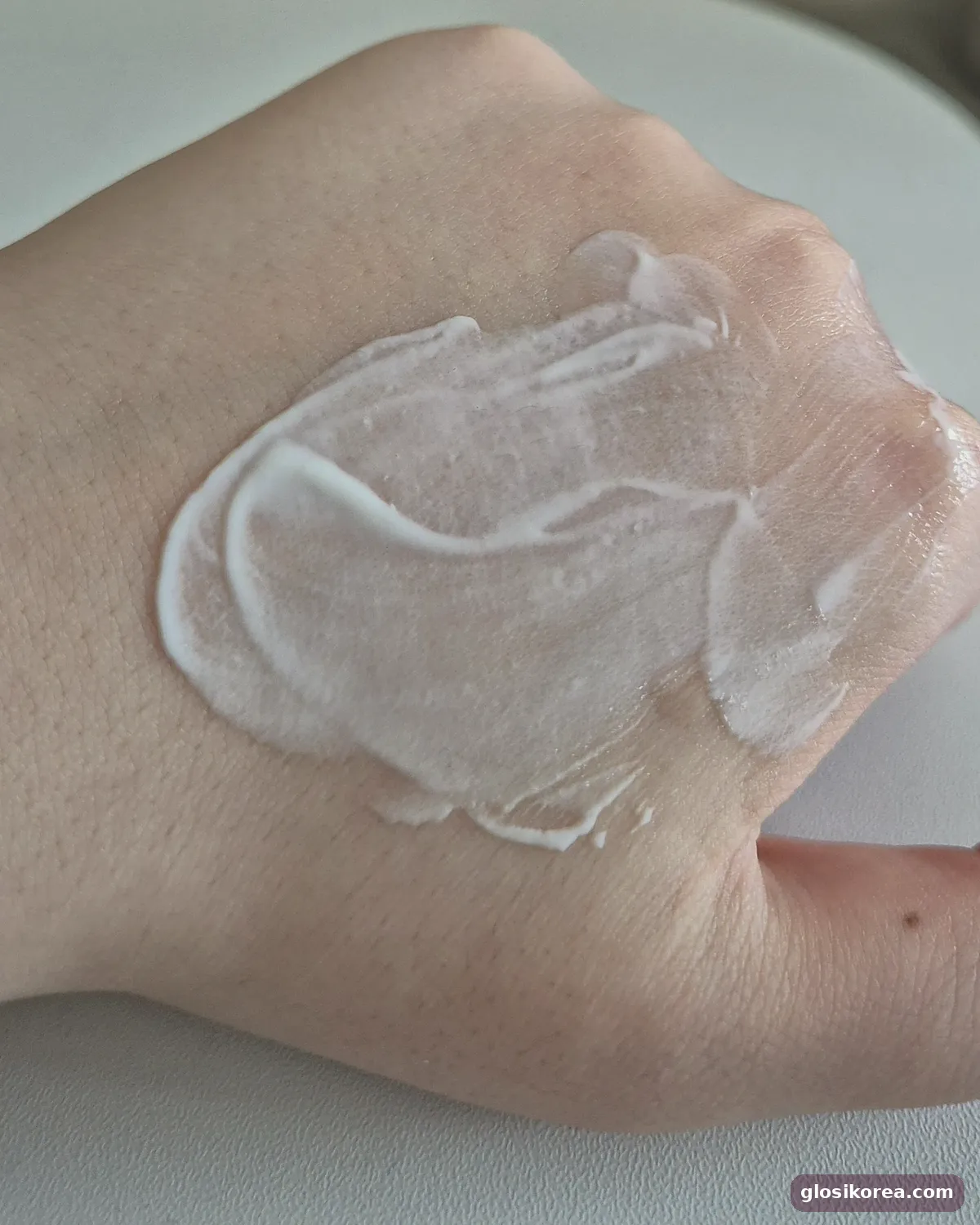 Dr.G R.E.D Blemish Soothing Up Sun spread on the back of a hand