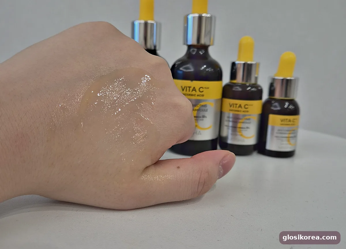 MISSHA Vita C Plus ampoule spread on the back of a hand, absorbing
