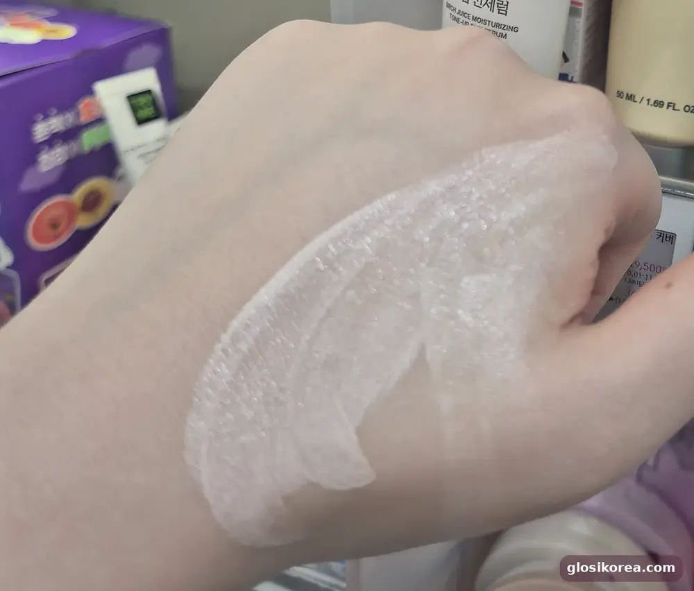 ROUND LAB Birch tone-up sun serum blended on the back of my hand