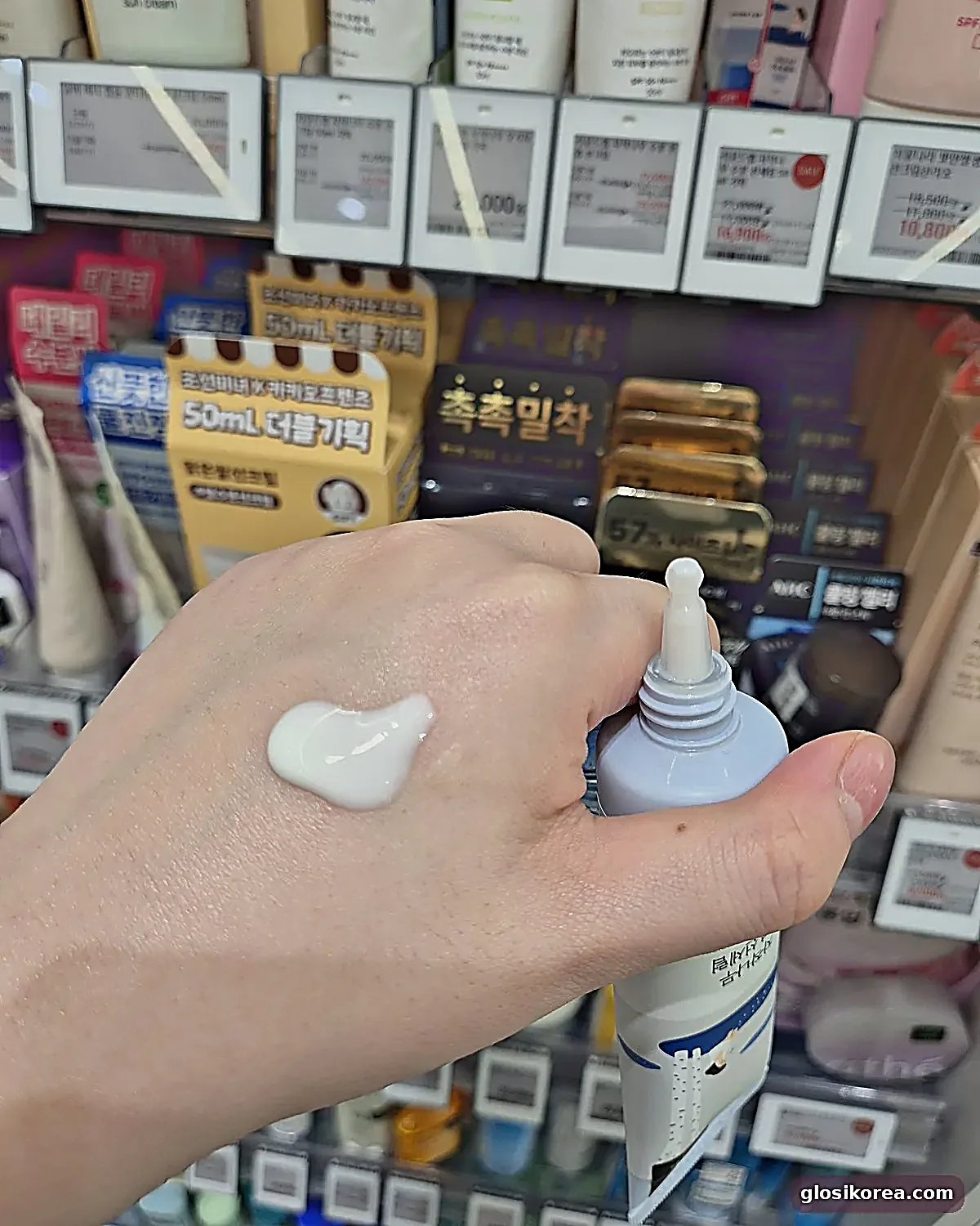 ROUND LAB Birch Juice Sun Serum texture swatch on the back of a hand